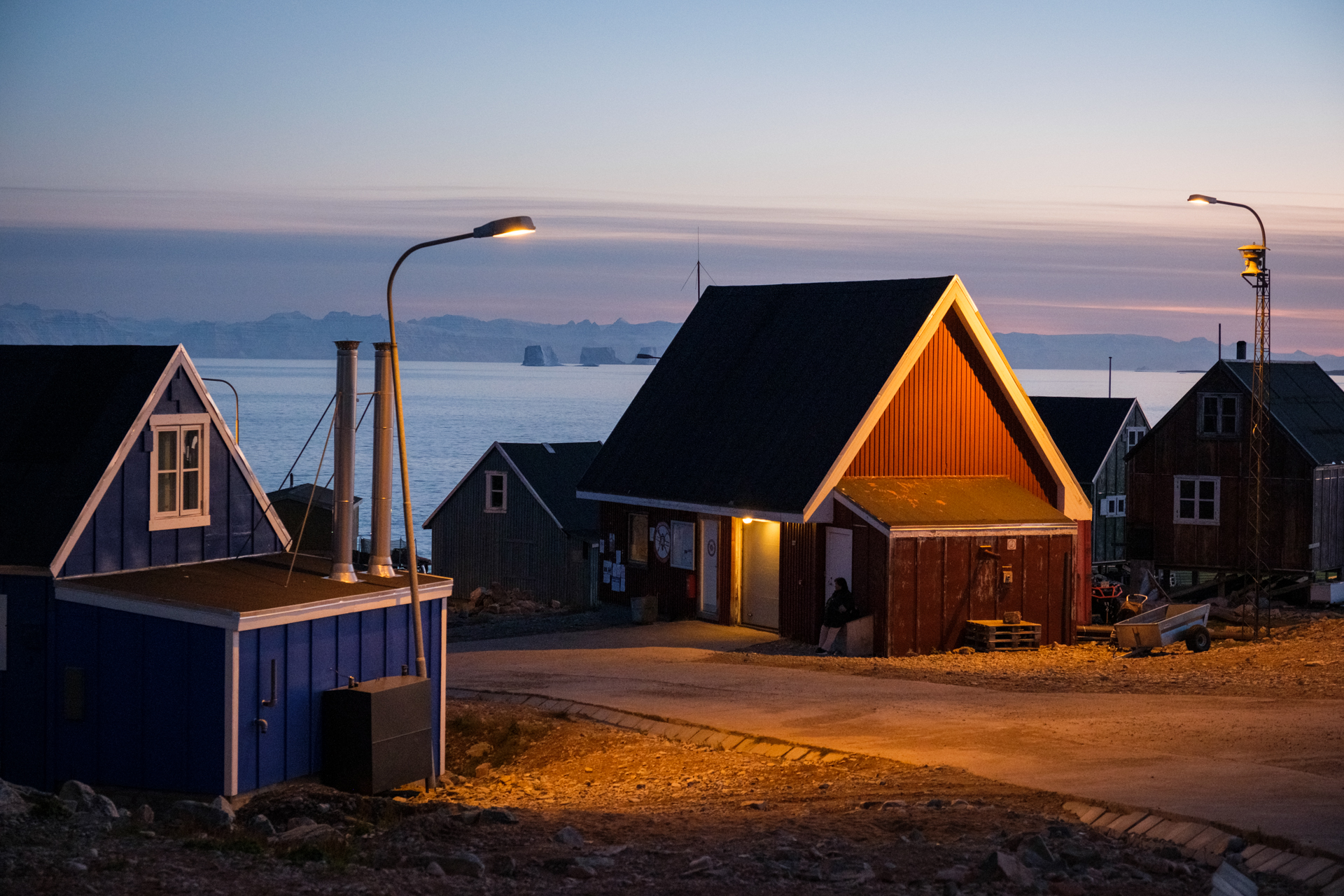 Street scene in Ittoqqortoormiit in Scoresbysund during blue hour.